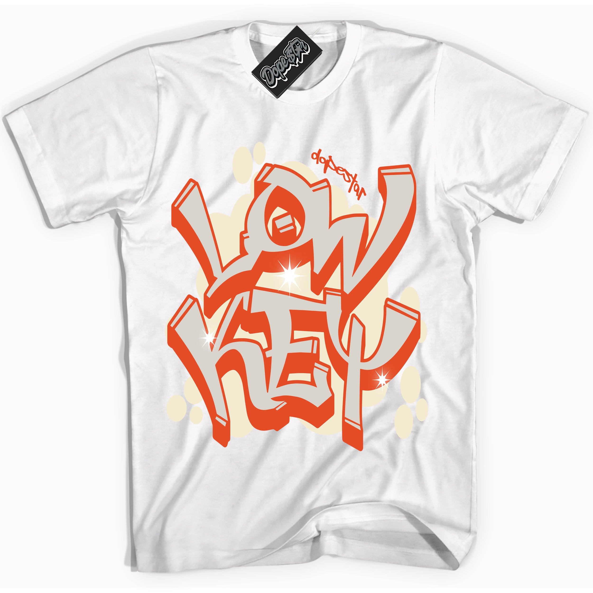 White “Low Key” T-shirt by Dope Star Brand®, styled to match Cinnabar 1s sneakers