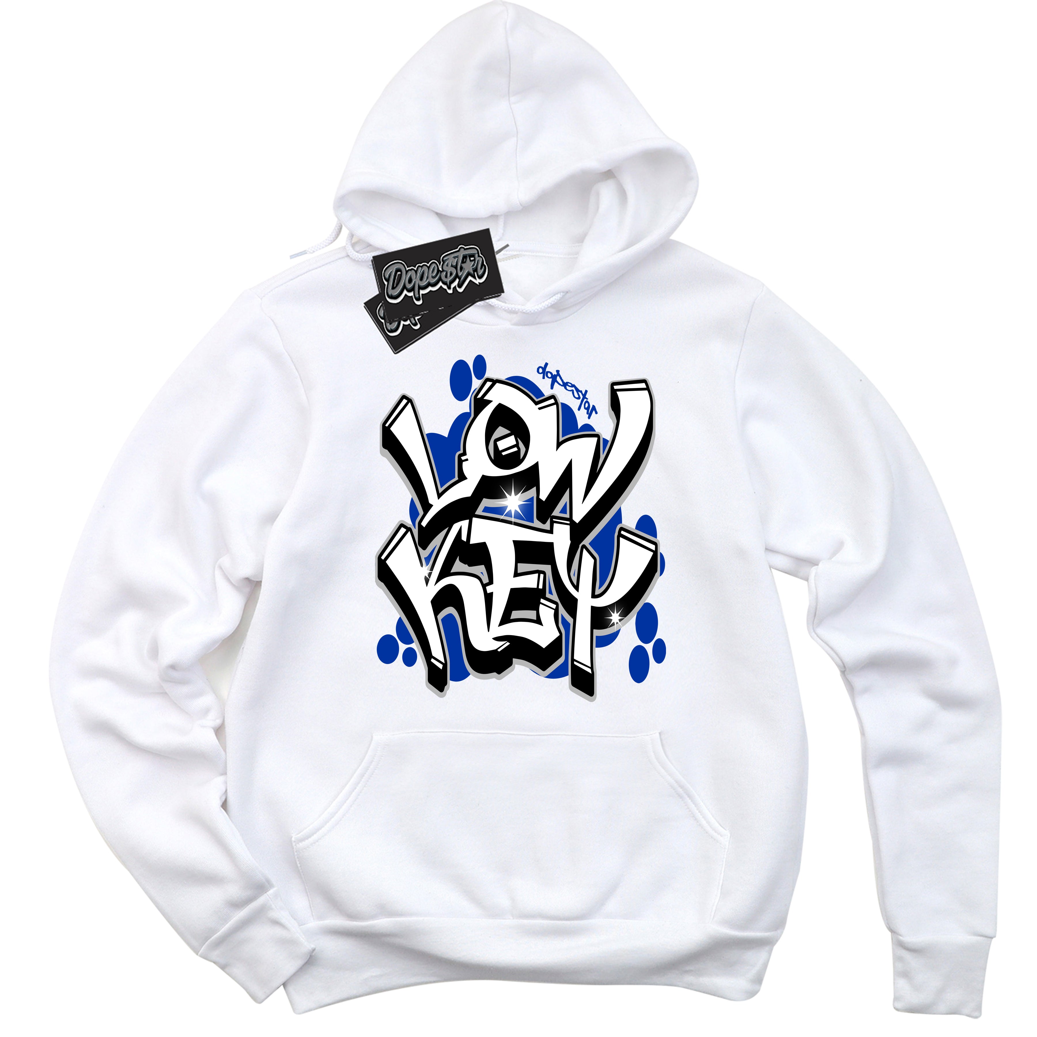 White “Low Key” Hoodie by Dope Star Brand®, styled to match Deep Royal Blue 1s sneakers