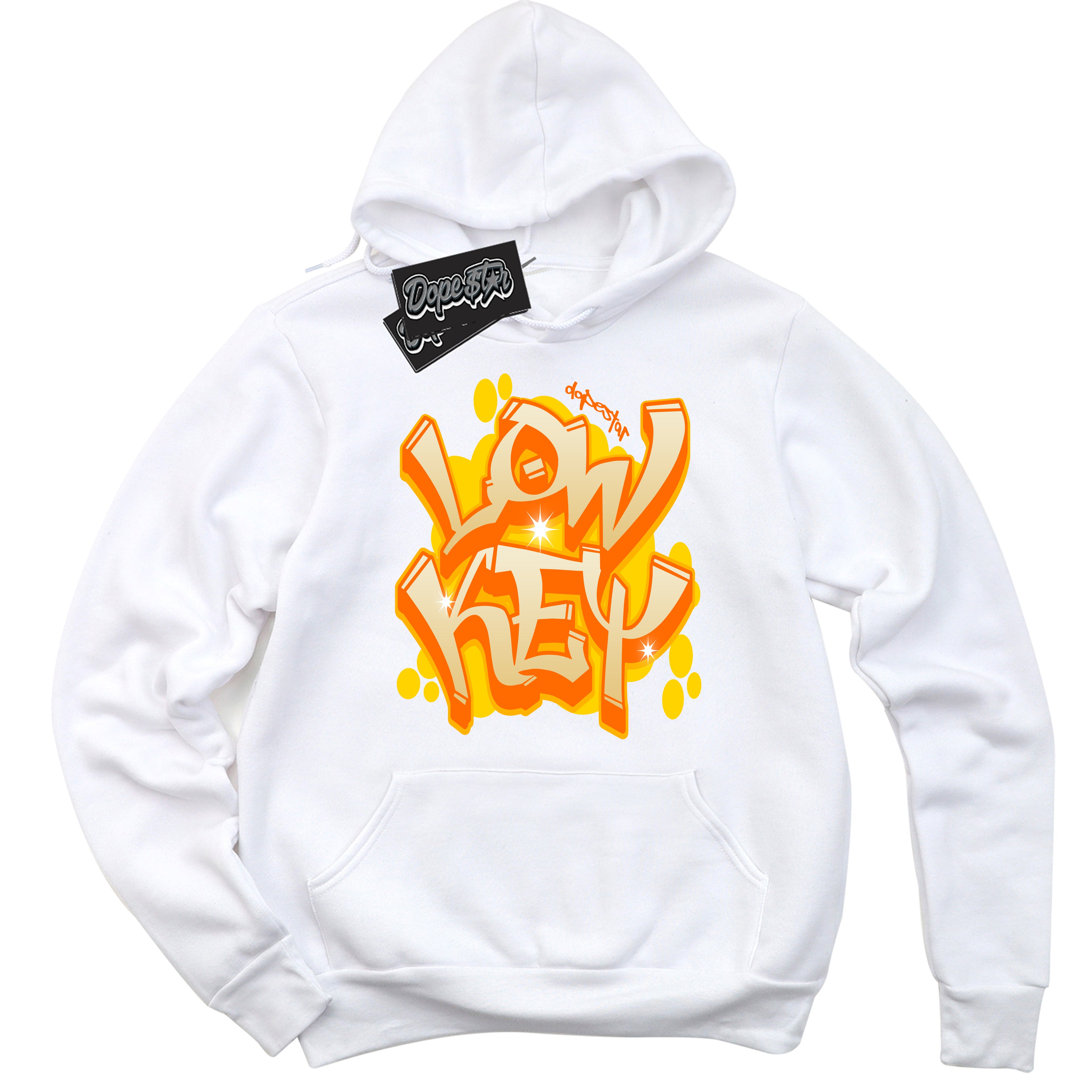 White “Low Key” Hoodie by Dope Star Brand®, styled to match Saturn Gold Dunk sneakers.