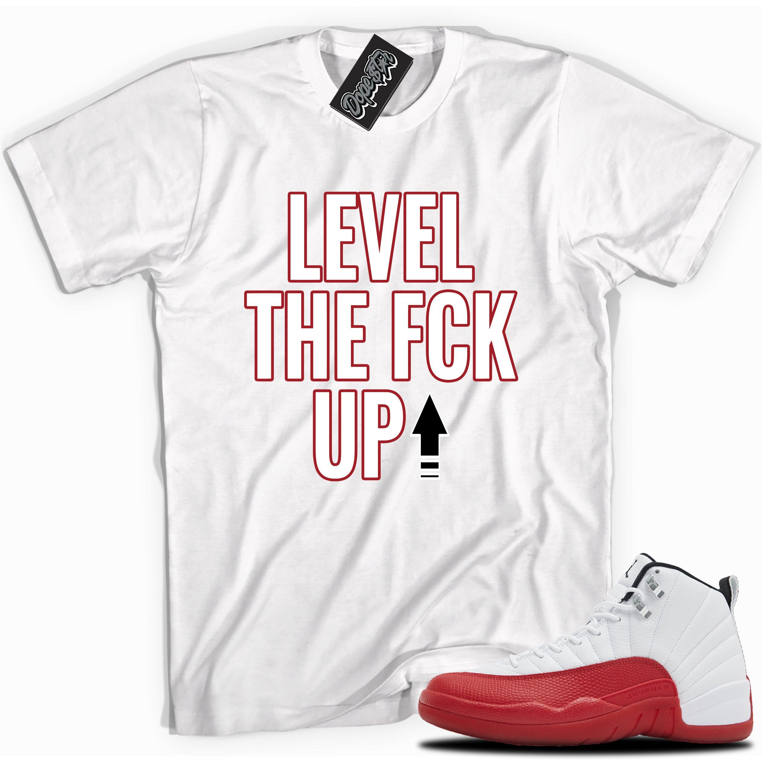 Cool White graphic tee with “ Level The Fck Up ” print, that perfectly matches Air Jordan 12 Retro Cherry Red 2023 red and white sneakers