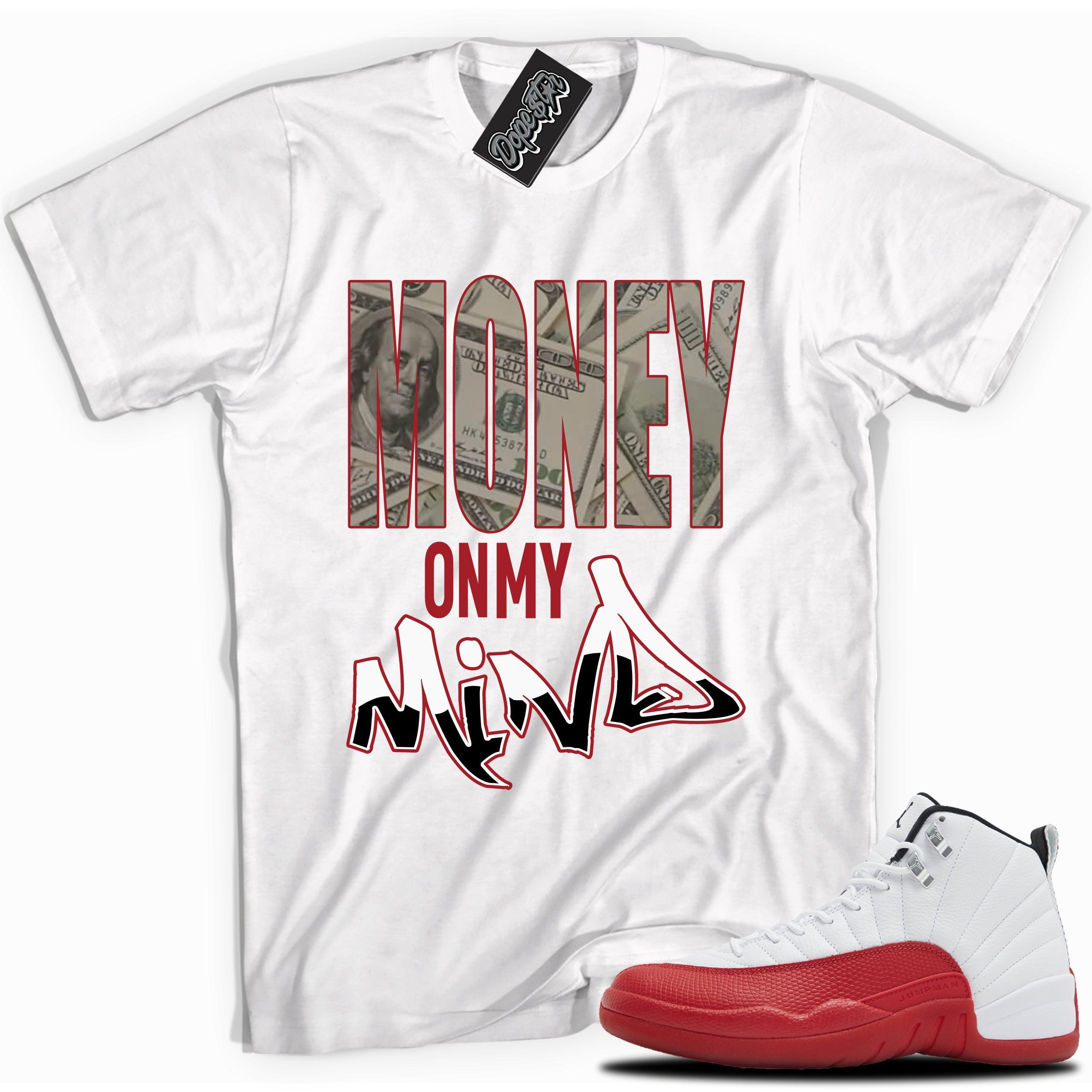 Cool White graphic tee with “ Money On My Mind ” print, that perfectly matches Air Jordan 12 Retro Cherry Red 2023 red and white sneakers