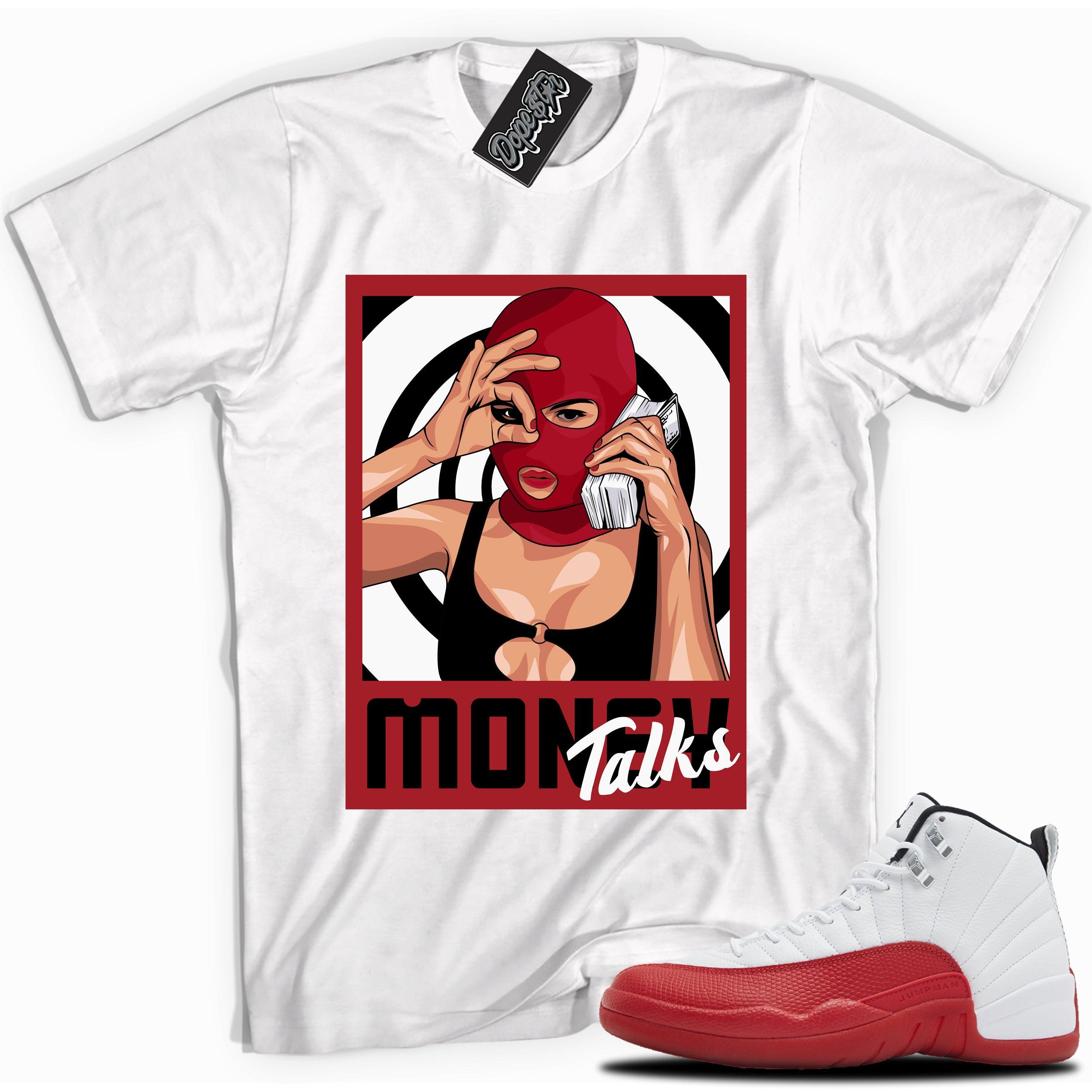 Cool White graphic tee with “ Money Talks ” print, that perfectly matches Air Jordan 12 Retro Cherry Red 2023 red and white sneakers