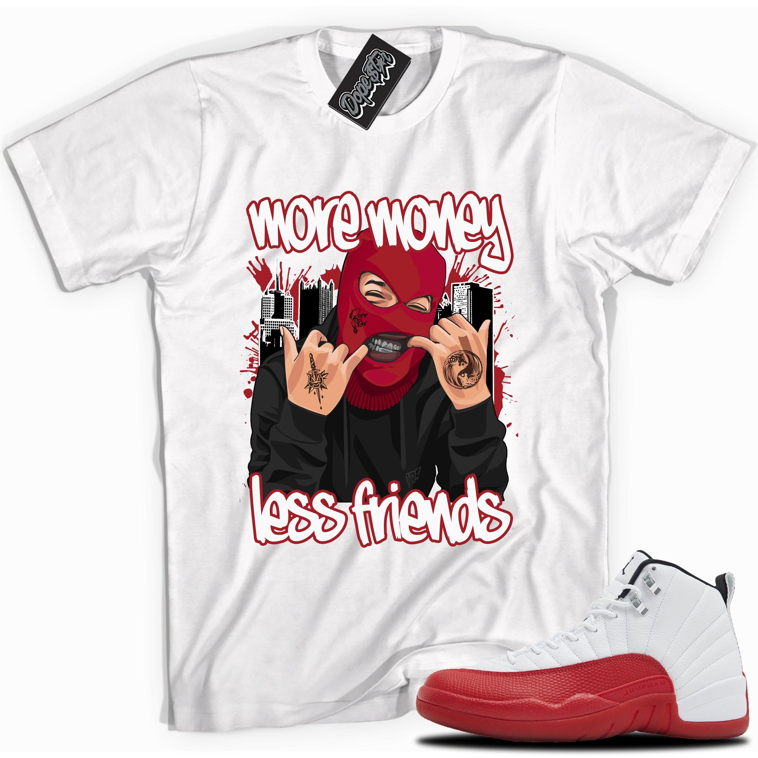 Cool White graphic tee with “ More Money Less Friends” print, that perfectly matches Air Jordan 12 Retro Cherry Red 2023 red and white sneakers