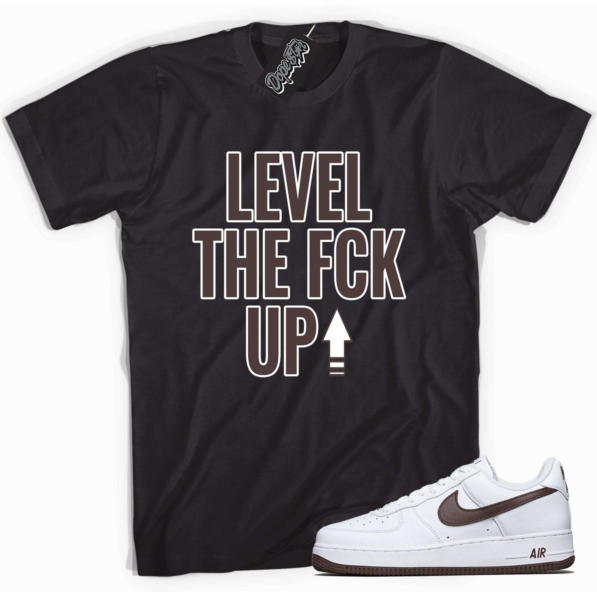Cool black graphic tee with 'Level Up' print, that perfectly matches Nike Air Force 1 Low White Chocolate sneakers.