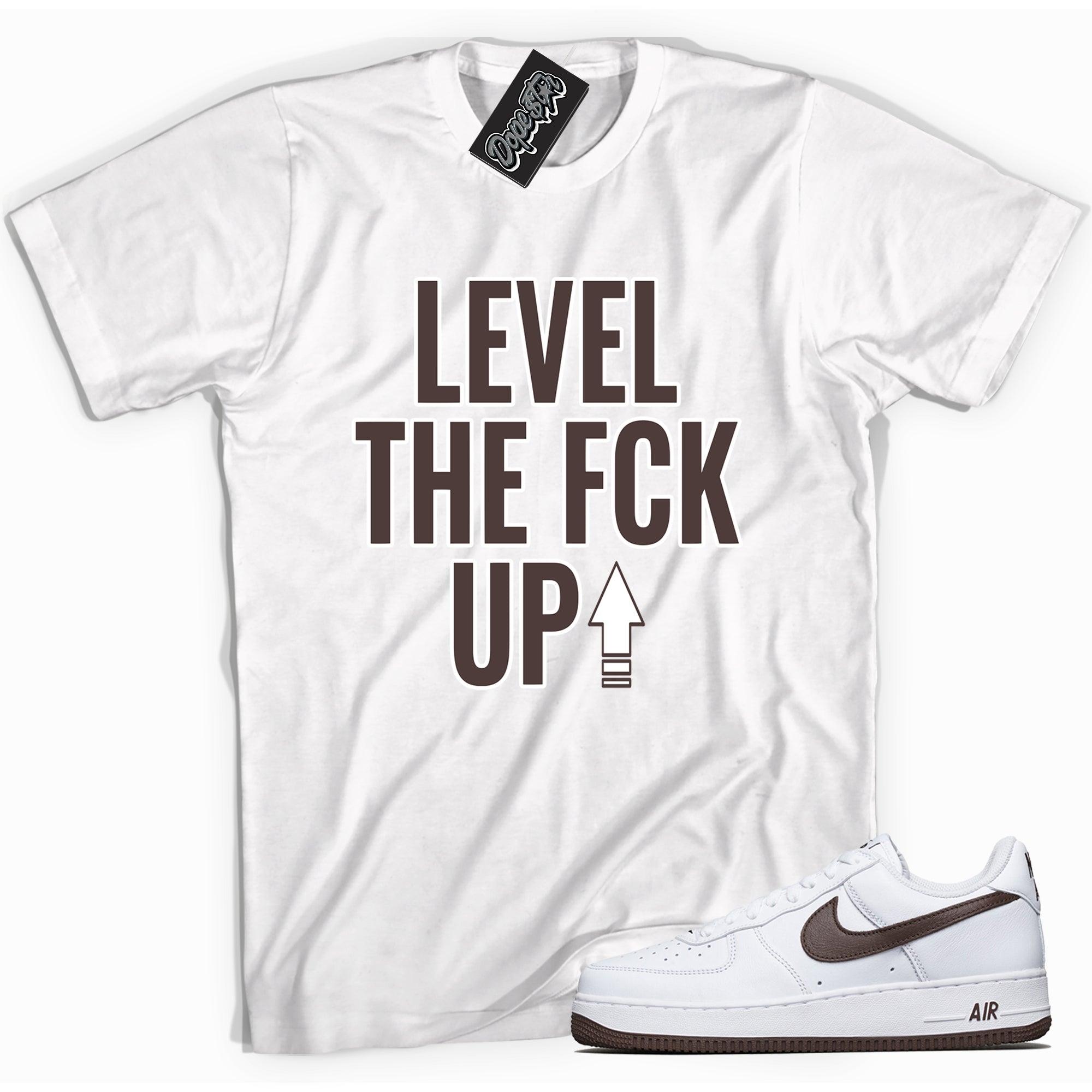 Cool white graphic tee with 'Level Up' print, that perfectly matches Nike Air Force 1 Low White Chocolate sneakers.