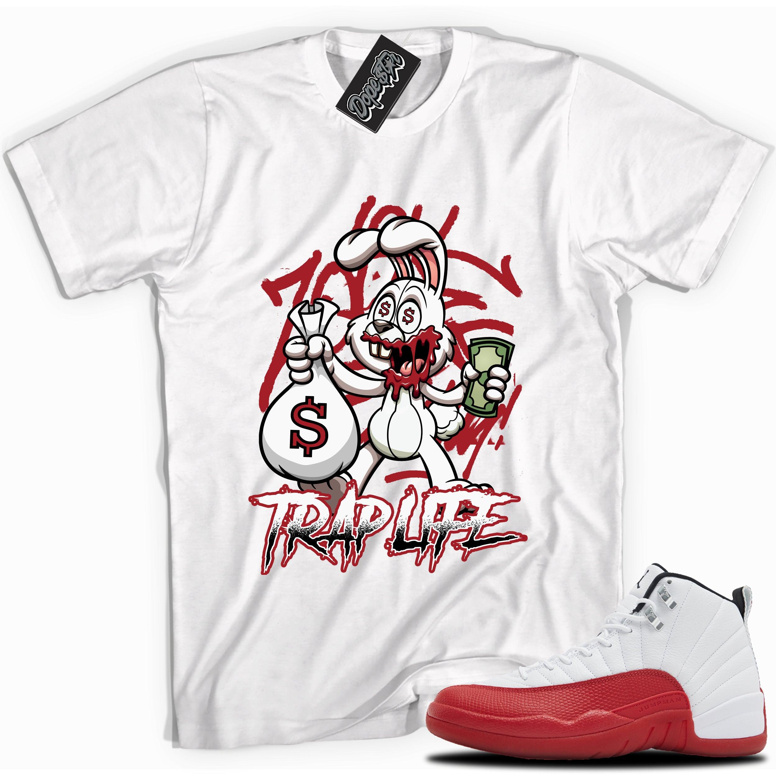 Cool White graphic tee with “Trap Rabbit” print, that perfectly matches Air Jordan 12 Retro Cherry Red 2023 red and white sneakers
