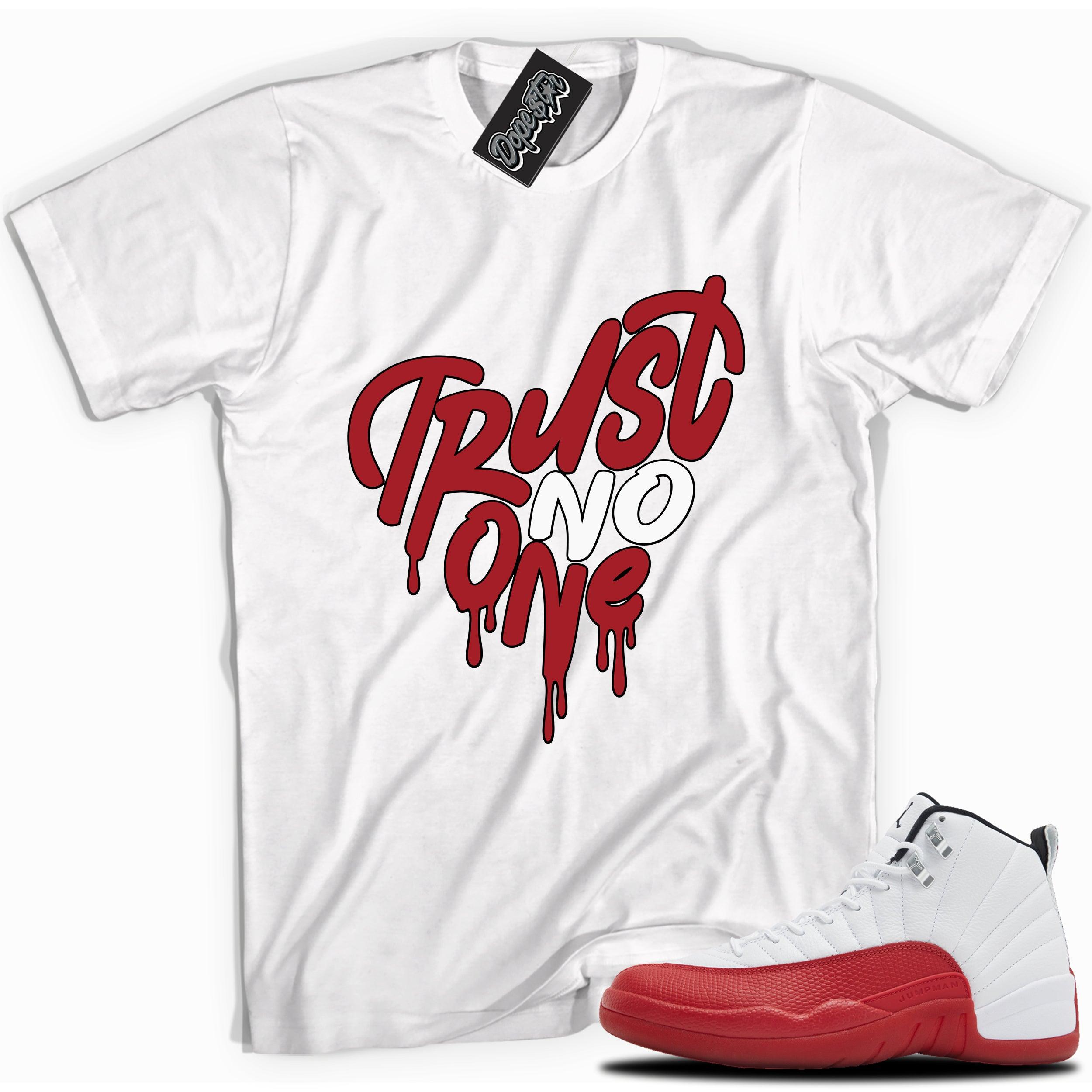 Cool White graphic tee with “Trust No One Heart” print, that perfectly matches Air Jordan 12 Retro Cherry Red 2023 red and white sneakers
