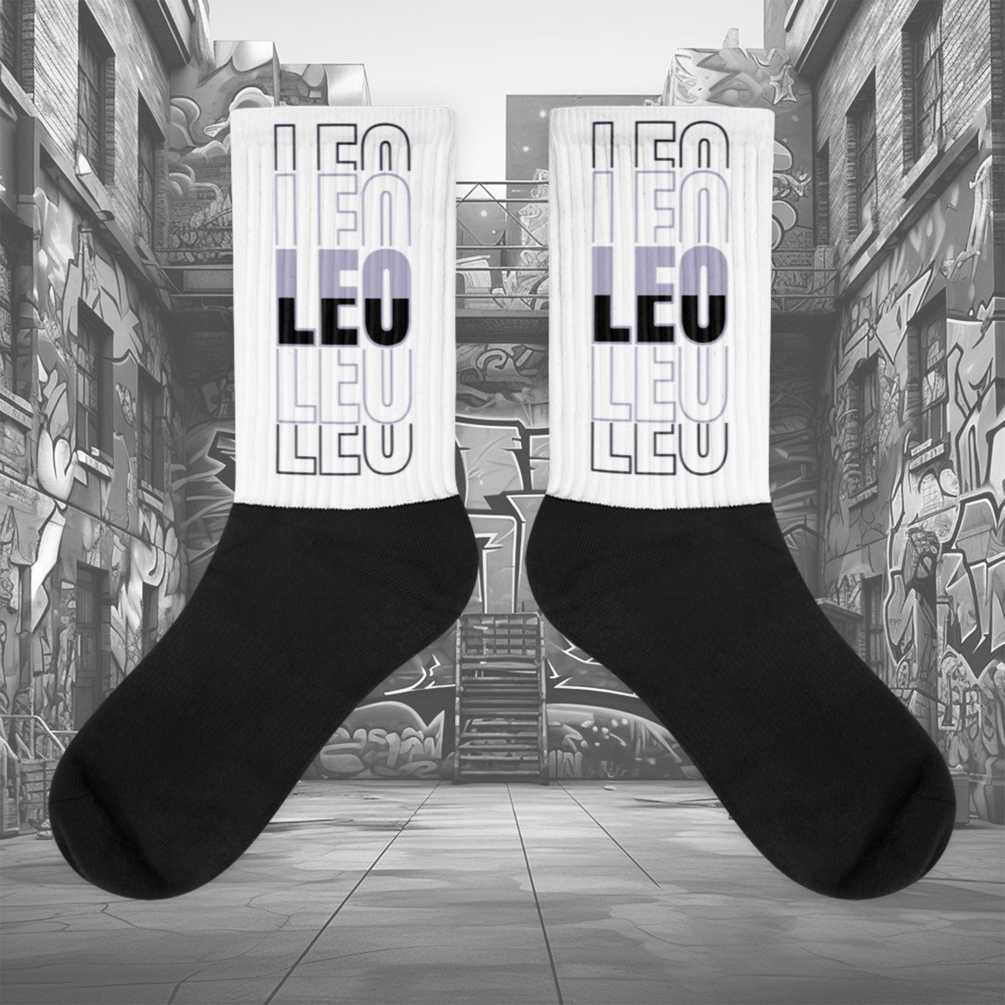 Showcases the view of the socks, highlighting the vibrant 'LEO' design, which perfectly complements the Air Jordan 8 Winterized  sneakers. The intricate pattern and color scheme inspired by the  theme are prominently displayed.  Focusing on the ribbed leg , cusioned bottoms and the snug fit of the socks. This angle provides a clear view of the texture and quality of the material blend.