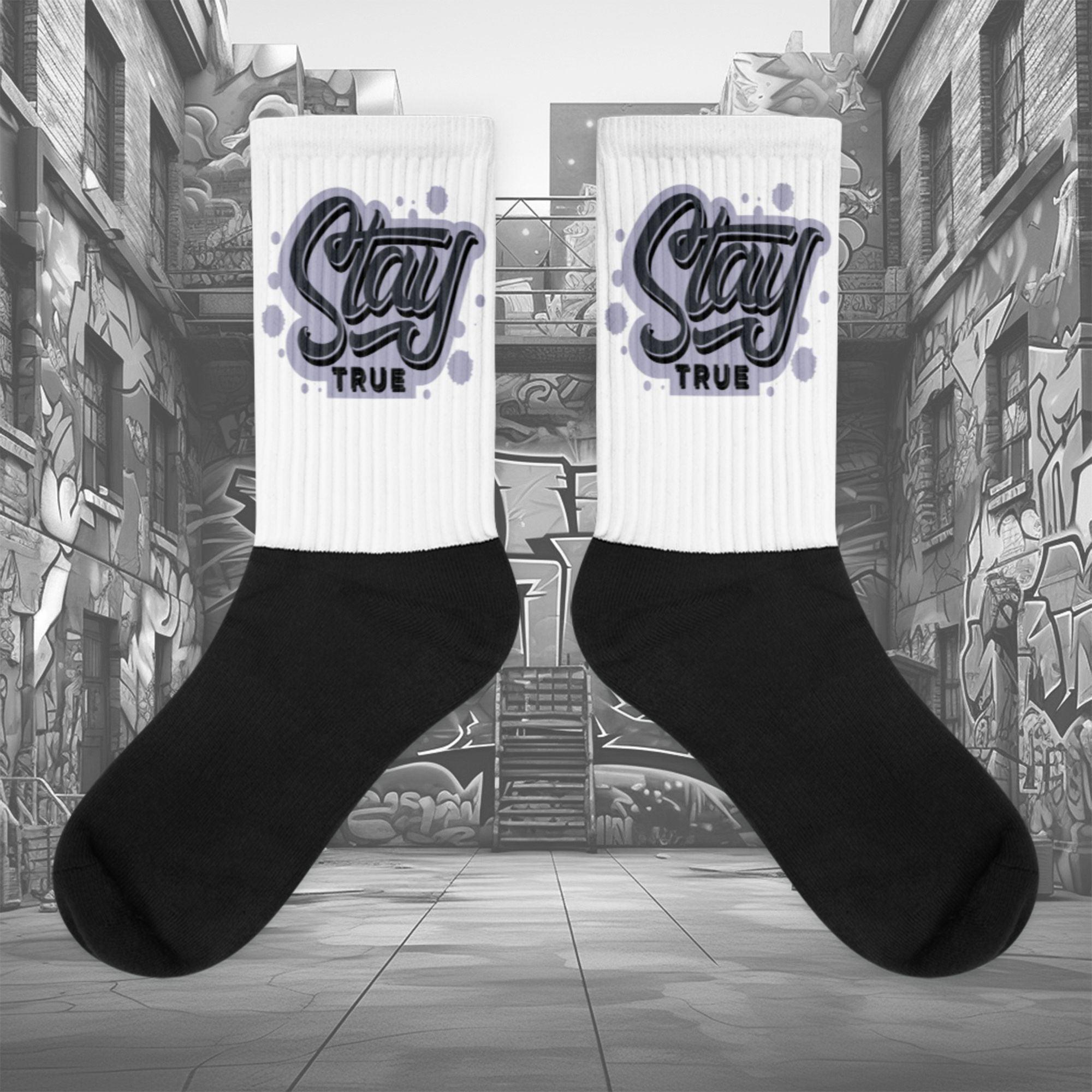 Showcases the view of the socks, highlighting the vibrant 'Stay True' design, which perfectly complements the Air Jordan 8 Winterized  sneakers. The intricate pattern and color scheme inspired by the  theme are prominently displayed.  Focusing on the ribbed leg , cusioned bottoms and the snug fit of the socks. This angle provides a clear view of the texture and quality of the material blend.