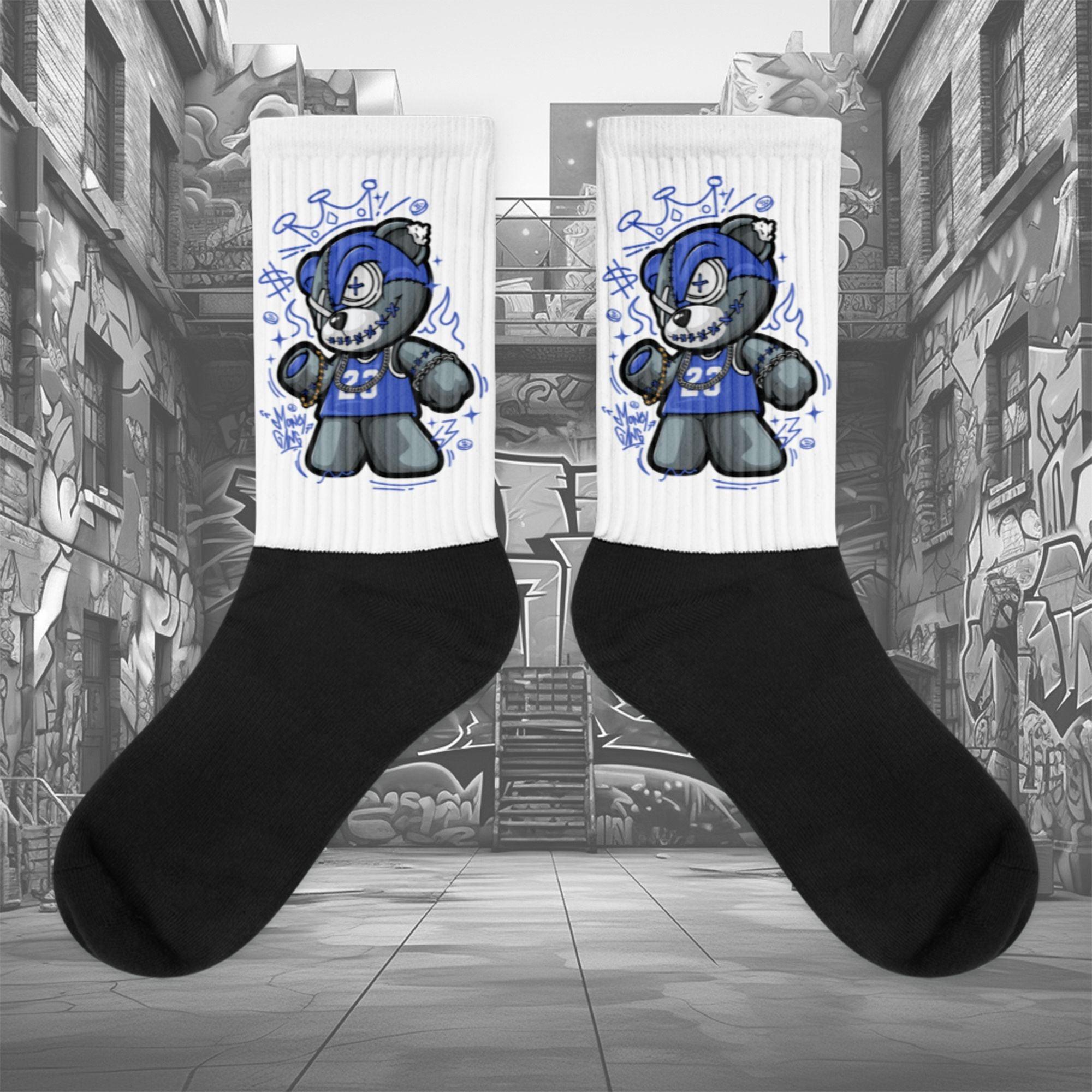 Showcases the view of the socks, highlighting the vibrant ' MEDUSA ' design, which perfectly complements the Nike Dunk Disrupt 2 Hyper Royal sneakers. The intricate pattern and color scheme inspired by the theme are prominently displayed. Focusing on the ribbed leg , cusioned bottoms and the snug fit of the socks. This angle provides a clear view of the texture and quality of the material blend.