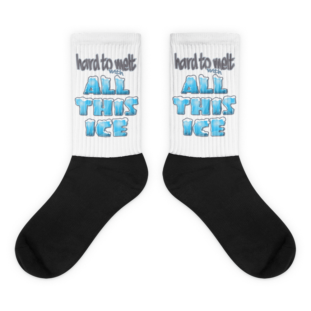 Showcases the view of the socks, highlighting the vibrant ‘All This Ice ‘ design, which perfectly complements the sneakers. The intricate pattern and color scheme inspired Air Jordan 11 Retro Low Cement Grey. Focusing on the ribbed leg , cusioned bottoms and the snug fit of the socks. This angle provides a clear view of the texture and quality of the material blend.