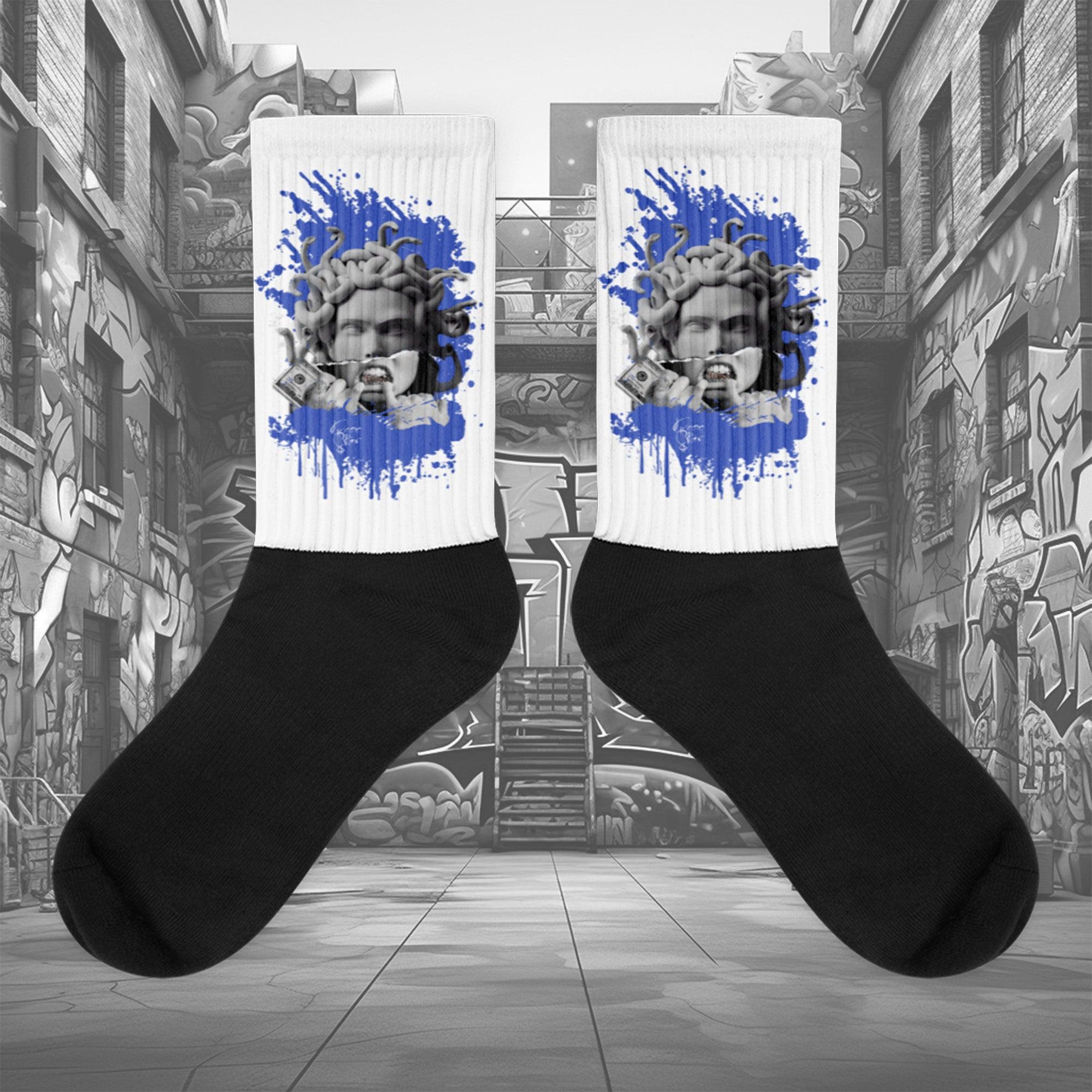 Showcases the view of the socks, highlighting the vibrant ' MEDUSA ' design, which perfectly complements the Nike Dunk Disrupt 2 Hyper Royal sneakers. The intricate pattern and color scheme inspired by the theme are prominently displayed. Focusing on the ribbed leg , cusioned bottoms and the snug fit of the socks. This angle provides a clear view of the texture and quality of the material blend.