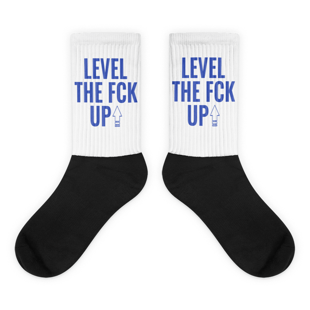 Showcases the view of the socks, highlighting the vibrant ' MEDUSA ' design, which perfectly complements the Nike Dunk Disrupt 2 Hyper Royal sneakers. The intricate pattern and color scheme inspired by the theme are prominently displayed. Focusing on the ribbed leg , cusioned bottoms and the snug fit of the socks. This angle provides a clear view of the texture and quality of the material blend.