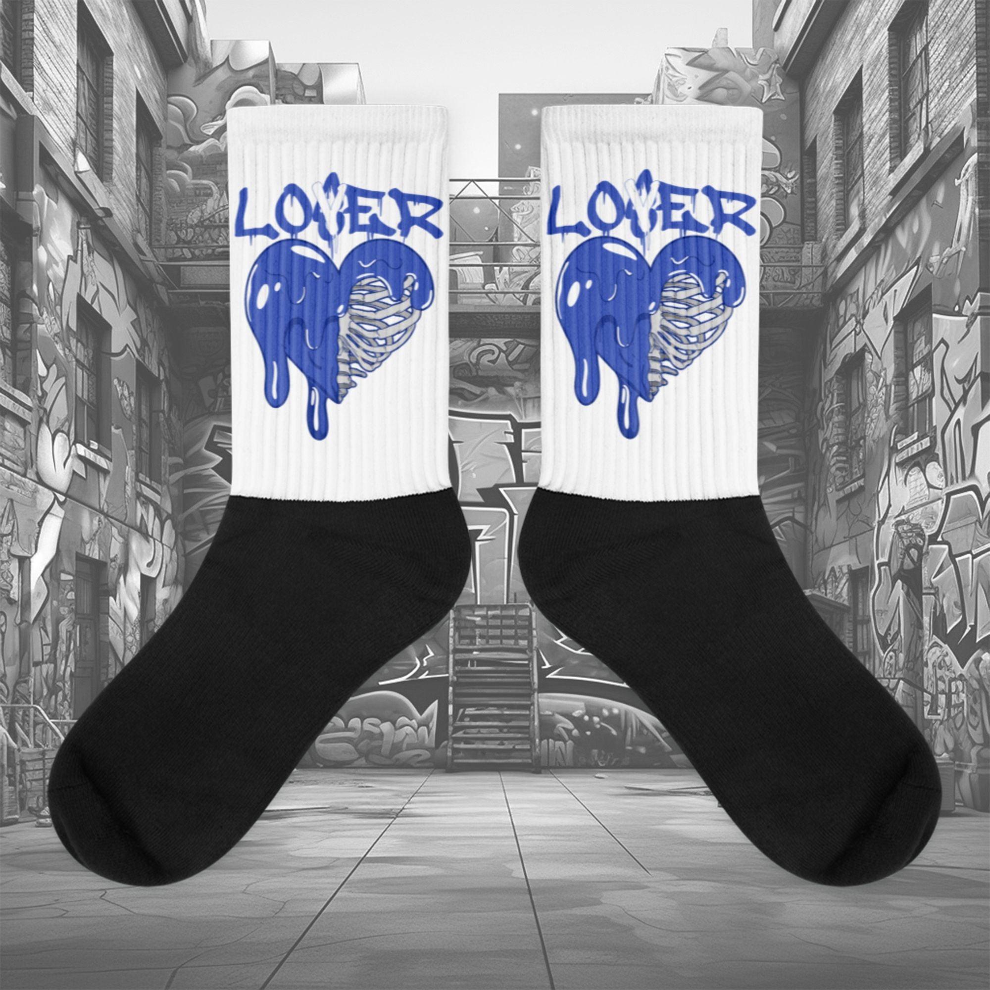 Showcases the view of the socks, highlighting the vibrant ' MEDUSA ' design, which perfectly complements the Nike Dunk Disrupt 2 Hyper Royal sneakers. The intricate pattern and color scheme inspired by the theme are prominently displayed. Focusing on the ribbed leg , cusioned bottoms and the snug fit of the socks. This angle provides a clear view of the texture and quality of the material blend.