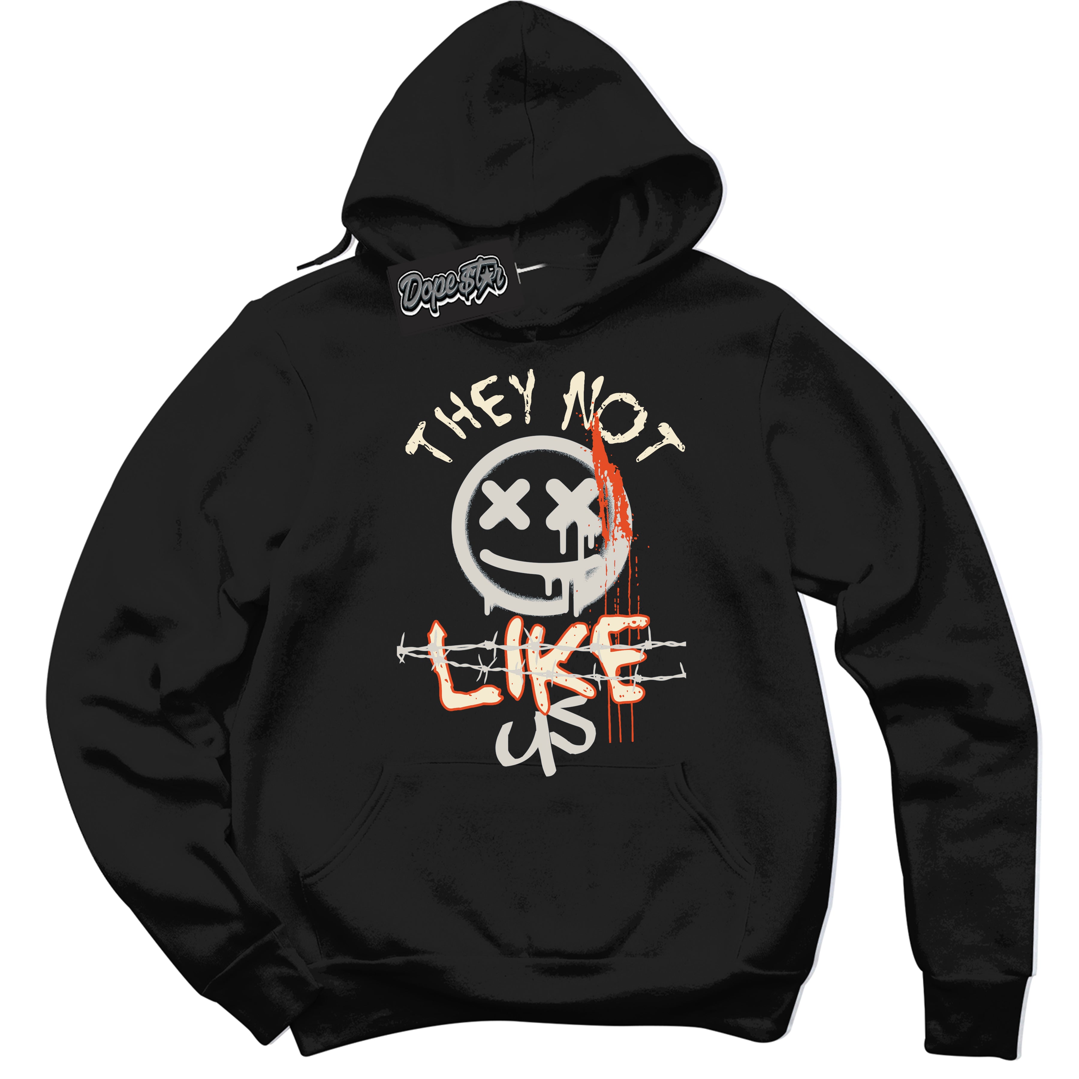 Black “They Not Like Us” Hoodie by Dope Star Brand®, styled to match Cinnabar 1s sneakers