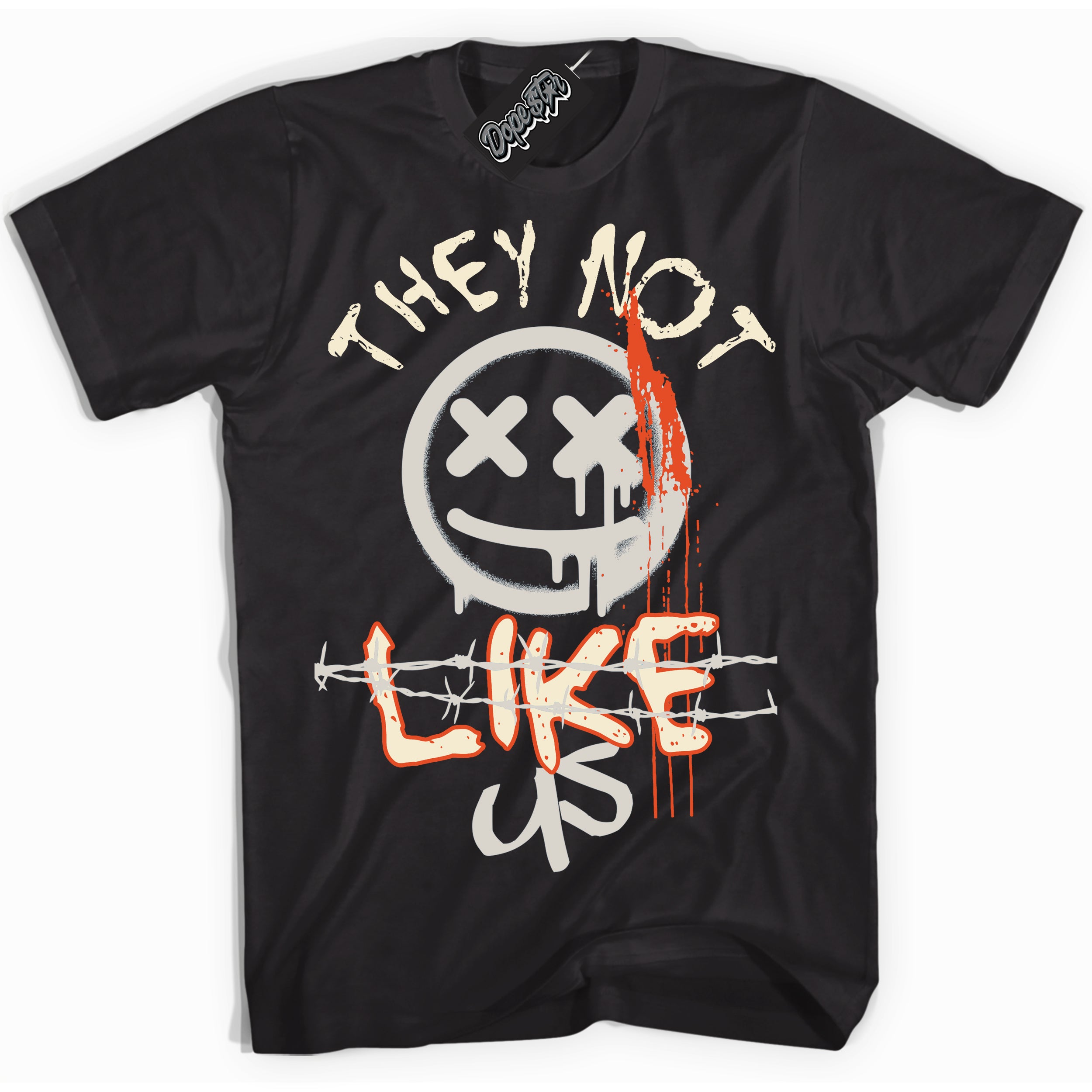 Black “They Not Like Us” T-shirt by Dope Star Brand®, styled to match Cinnabar 1s sneakers