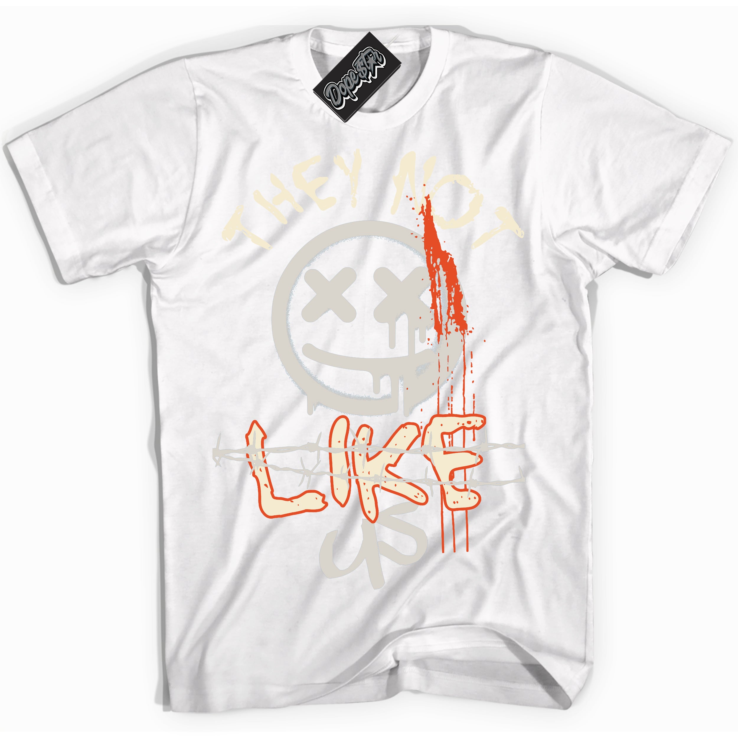 White “They Not Like Us” T-shirt by Dope Star Brand®, styled to match Cinnabar 1s sneakers