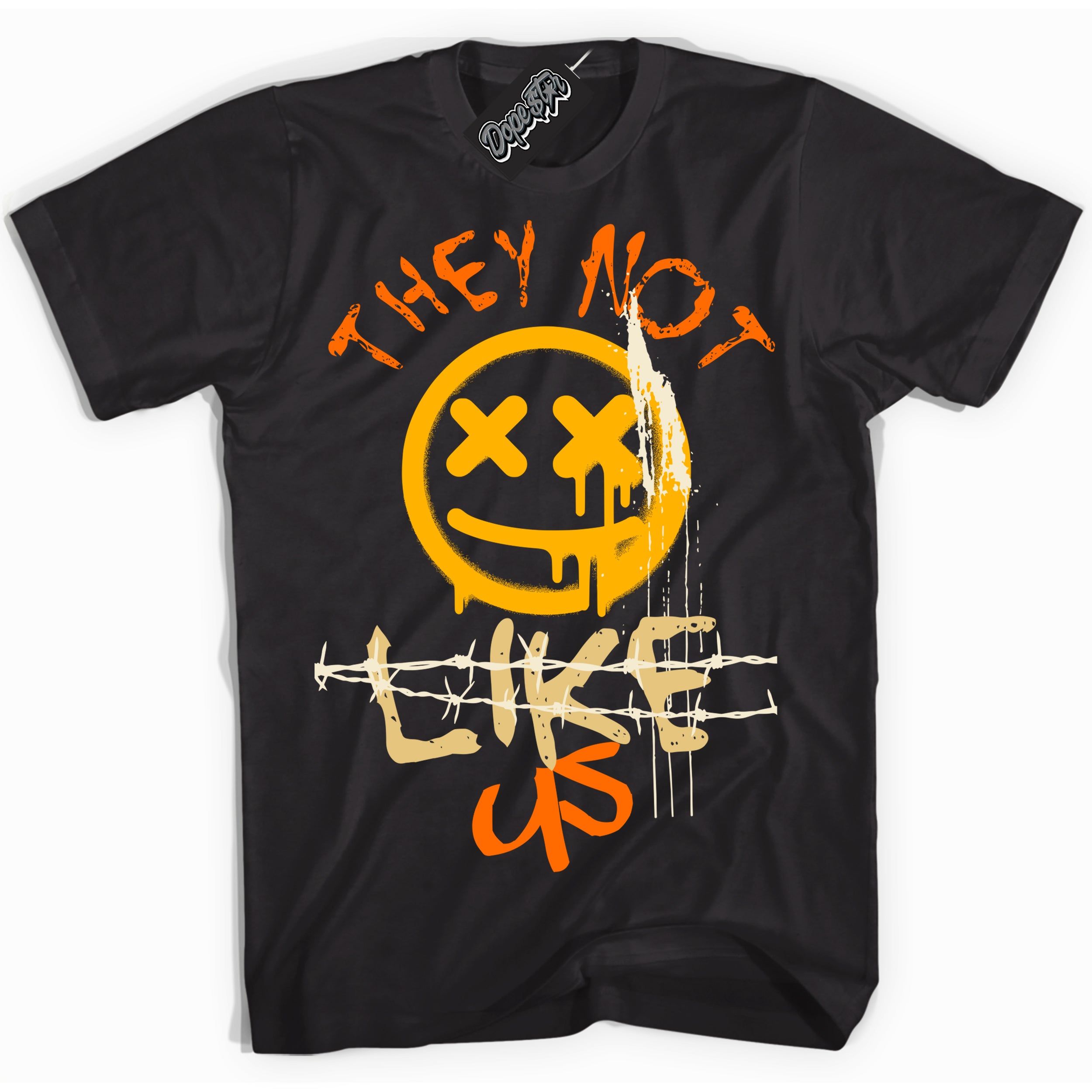 Black “They Not Like Us” T-shirt by Dope Star Brand®, styled to match Saturn Gold Dunk sneakers