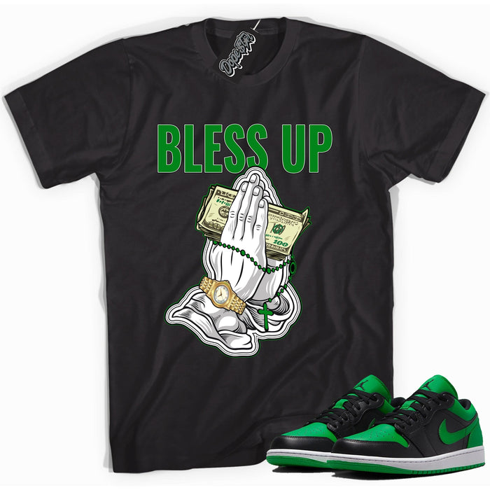 Cool black graphic tee with 'Bless Up' print, that perfectly matches Air Jordan 1 Low Lucky Green sneakers