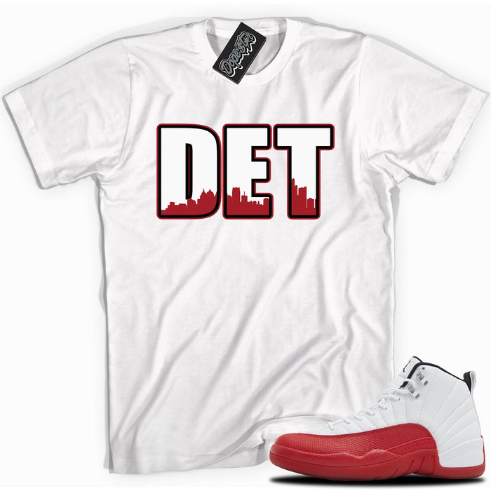 Cool White graphic tee with “ DETROIT ” print, that perfectly matches Air Jordan 12 Retro Cherry Red 2023 red and white sneakers