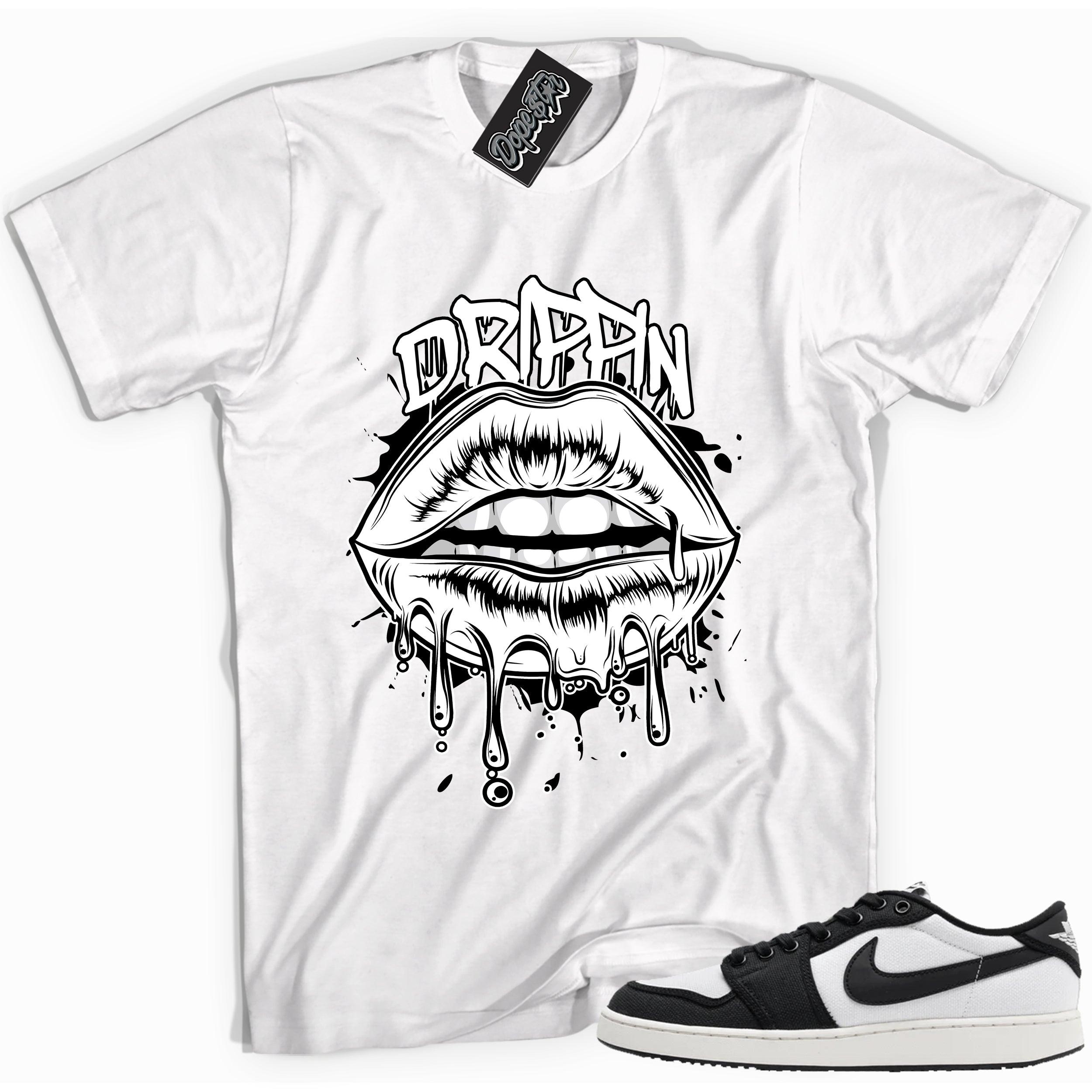 Cool white graphic tee with 'drippin' print, that perfectly matches Air Jordan 1 Retro Ajko Low Black & White sneakers.