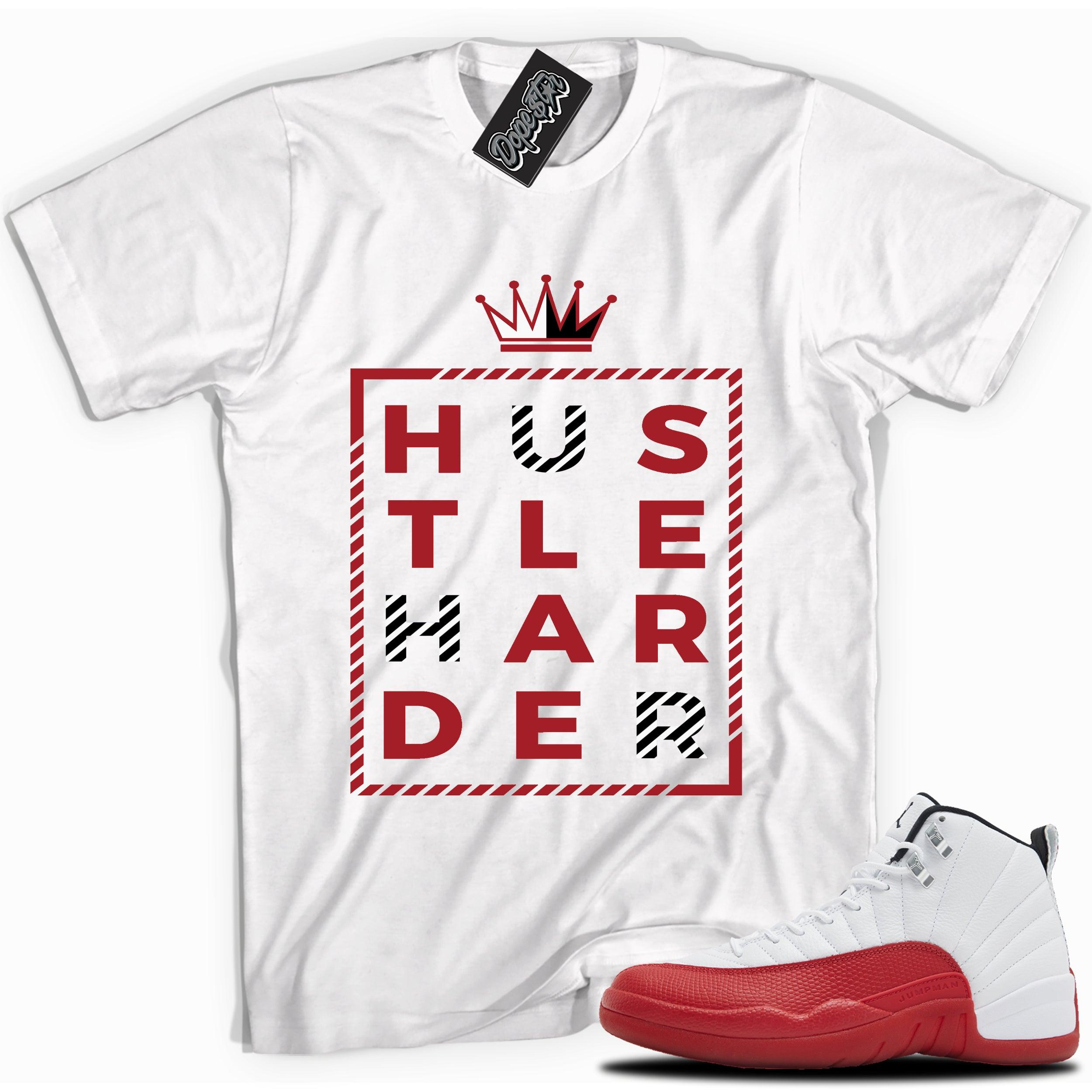 Cool White graphic tee with “  HUSTLE HARDER ” print, that perfectly matches Air Jordan 12 Retro Cherry Red 2023 red and white sneakers 