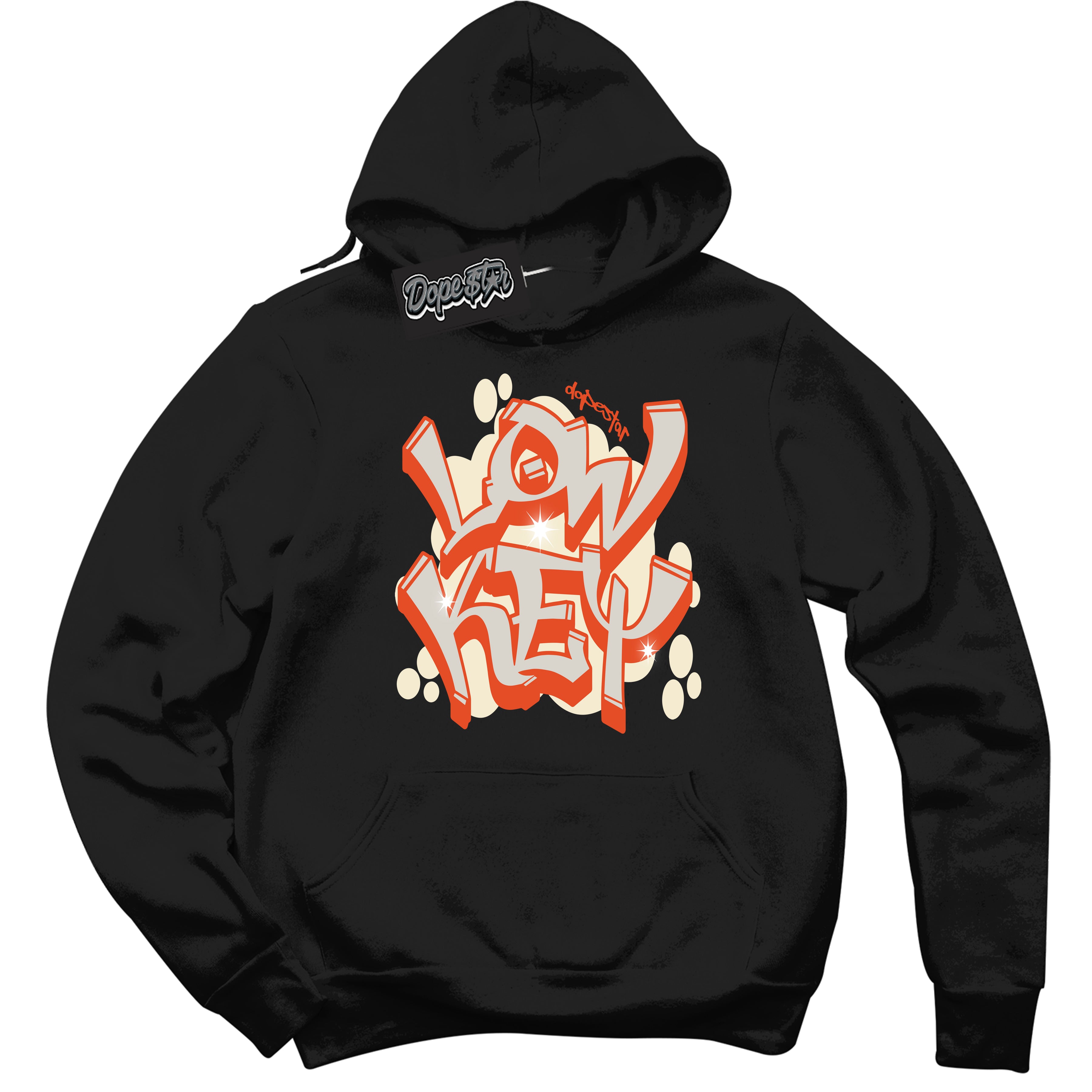 Black “Low Key” Hoodie by Dope Star Brand®, styled to match Cinnabar 1s sneakers
