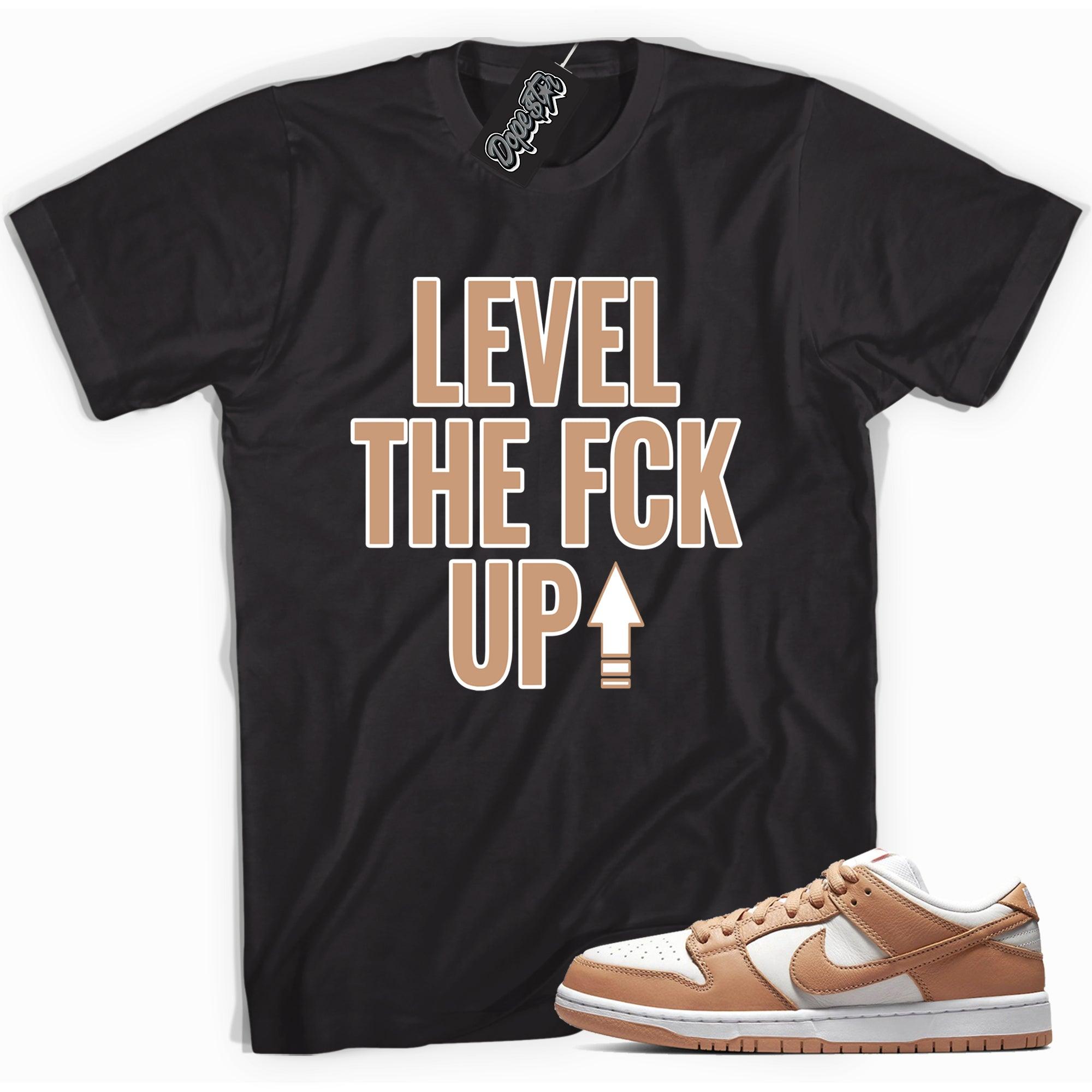 Cool black graphic tee with 'Level Up' print, that perfectly matches Nike Dunk Low Light Cognac sneakers.
