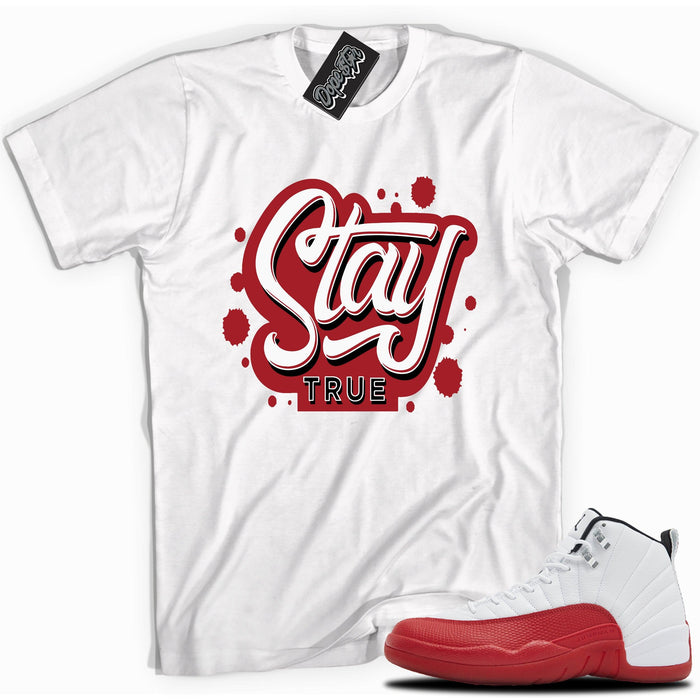 Cool White graphic tee with “Stay True” print, that perfectly matches Air Jordan 12 Retro Cherry Red 2023 red and white sneakers 