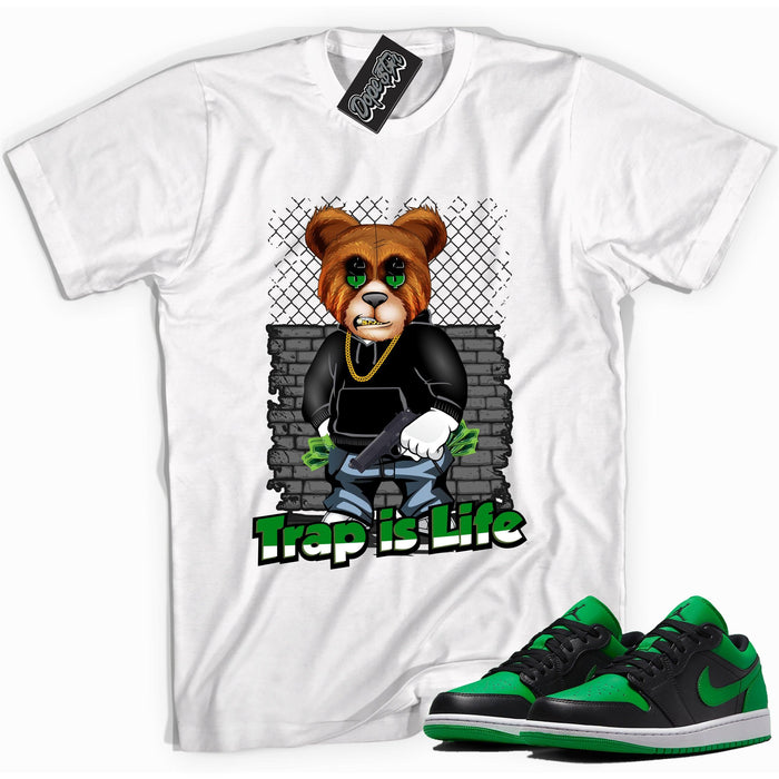 Cool white graphic tee with 'trap is life' print, that perfectly matches Air Jordan 1 Low Lucky Green sneakers