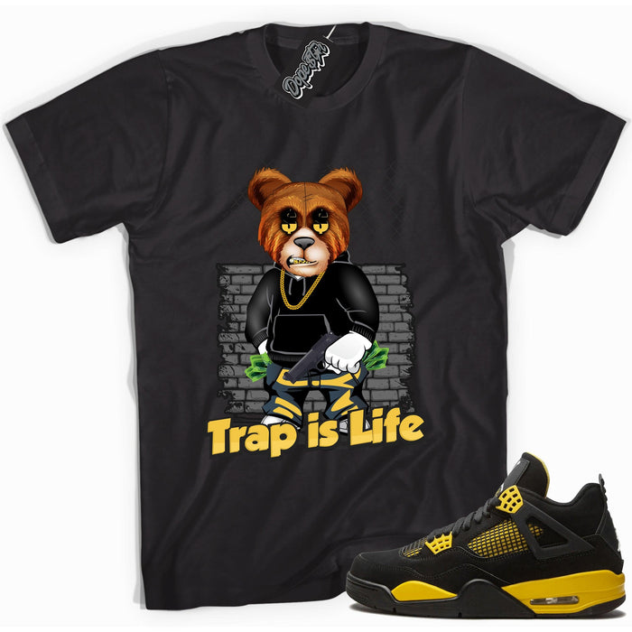 Cool black graphic tee with 'trap is life' print, that perfectly matches  Air Jordan 4 Thunder sneakers