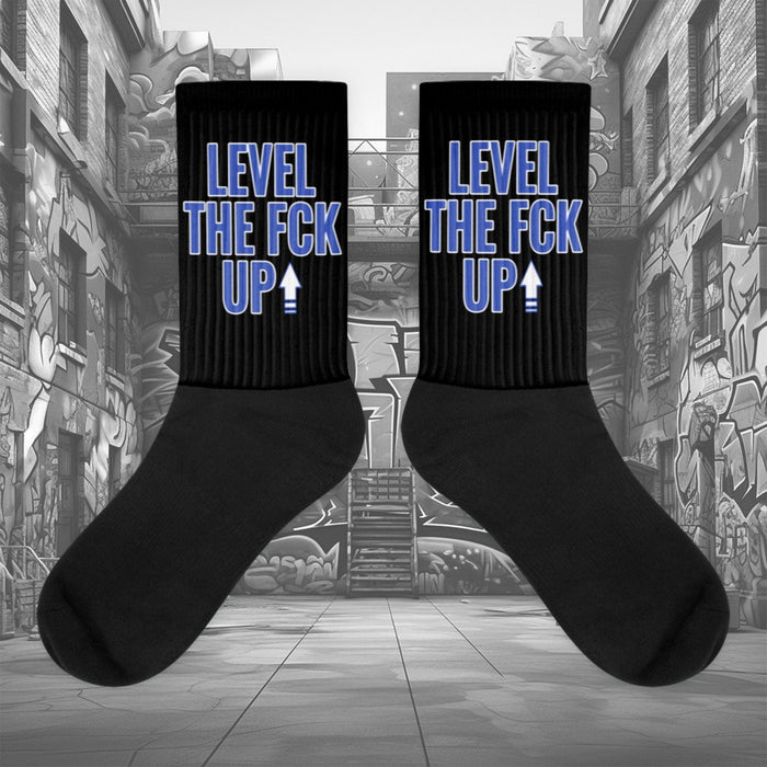  Showcases the view of the socks, highlighting the vibrant ' MEDUSA ' design, which perfectly complements the Nike Dunk Disrupt 2 Hyper Royal sneakers. The intricate pattern and color scheme inspired by the  theme are prominently displayed.  Focusing on the ribbed leg , cusioned bottoms and the snug fit of the socks. This angle provides a clear view of the texture and quality of the material blend.