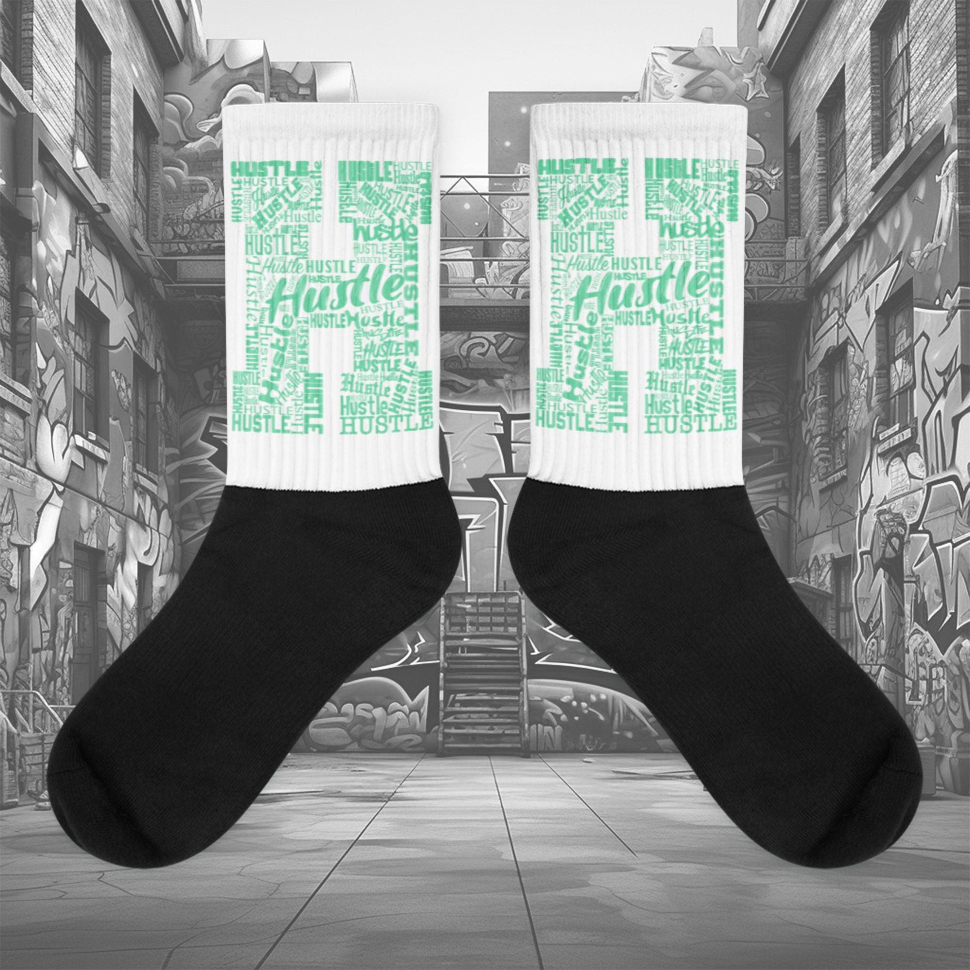  Showcases the view of the socks, highlighting the vibrant ' Hustle ' design, which perfectly complements the Nike Dunk Green Glow sneakers. The intricate pattern and color scheme inspired by the  theme are prominently displayed.  Focusing on the ribbed leg , cusioned bottoms and the snug fit of the socks. This angle provides a clear view of the texture and quality of the material blend.