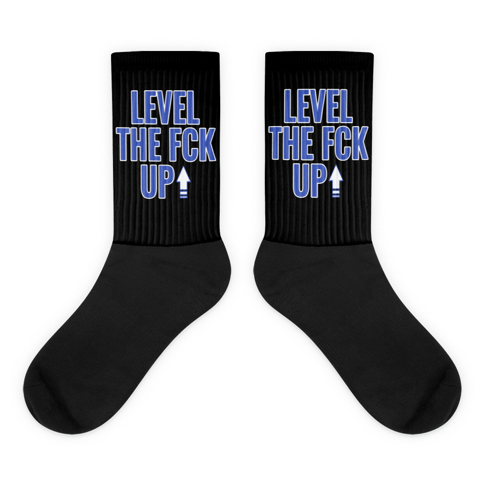  Showcases the view of the socks, highlighting the vibrant ' MEDUSA ' design, which perfectly complements the Nike Dunk Disrupt 2 Hyper Royal sneakers. The intricate pattern and color scheme inspired by the  theme are prominently displayed.  Focusing on the ribbed leg , cusioned bottoms and the snug fit of the socks. This angle provides a clear view of the texture and quality of the material blend.