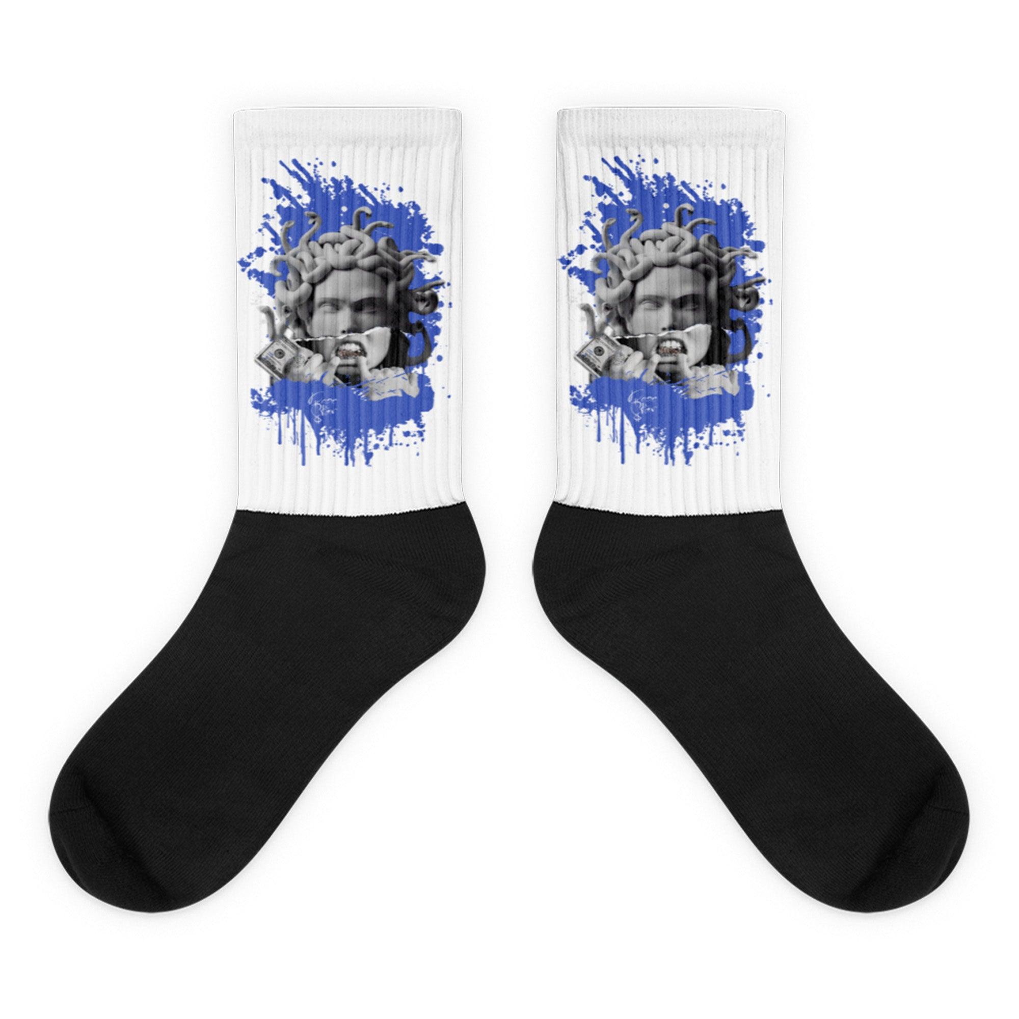 Showcases the view of the socks, highlighting the vibrant ' MEDUSA ' design, which perfectly complements the Nike Dunk Disrupt 2 Hyper Royal sneakers. The intricate pattern and color scheme inspired by the  theme are prominently displayed.  Focusing on the ribbed leg , cusioned bottoms and the snug fit of the socks. This angle provides a clear view of the texture and quality of the material blend.