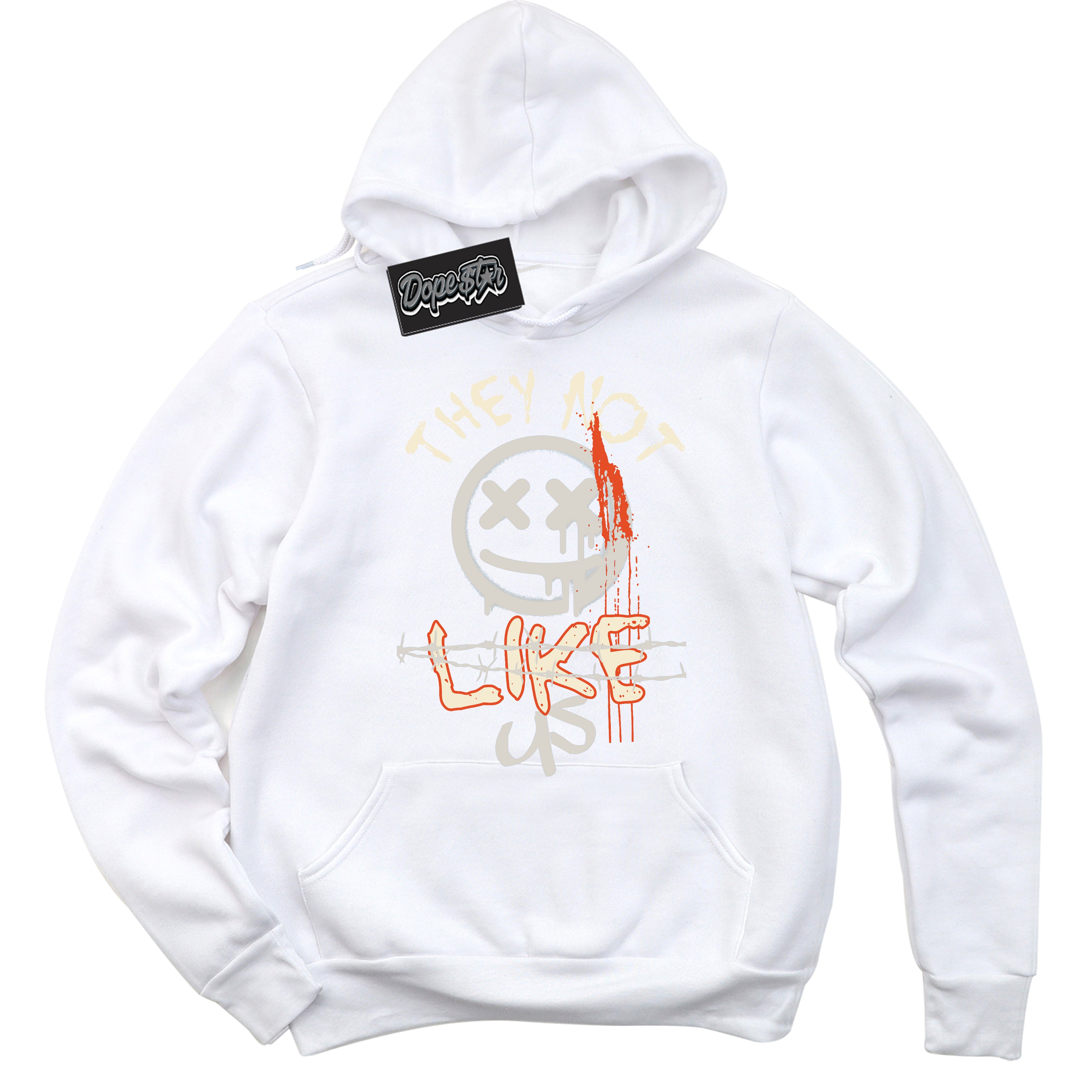 White “They Not Like Us” Hoodie by Dope Star Brand®, styled to match Cinnabar 1s sneakers
