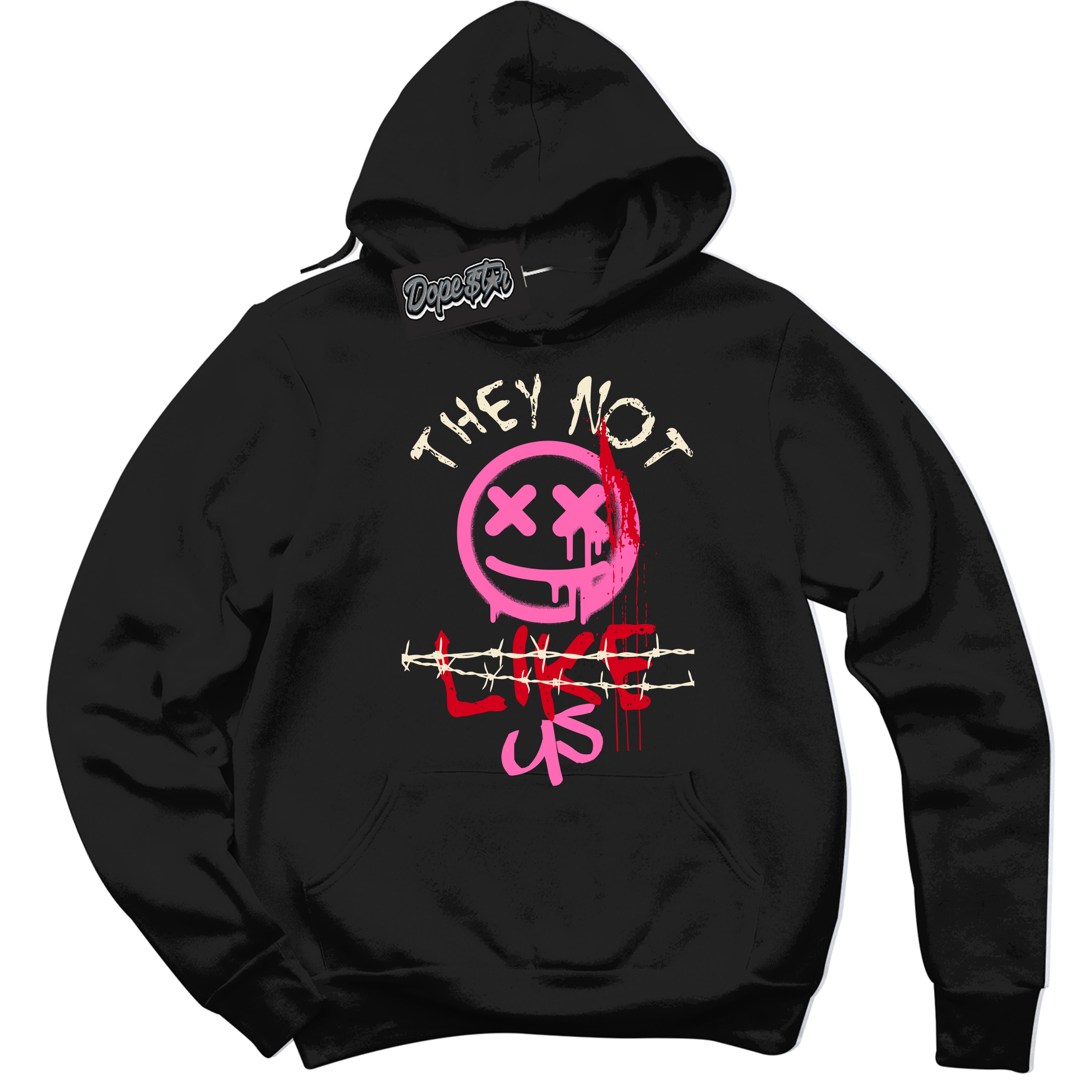 Black “They Not Like Us” Hoodie by Dope Star Brand®, styled to match Pink Satin 1s sneakers