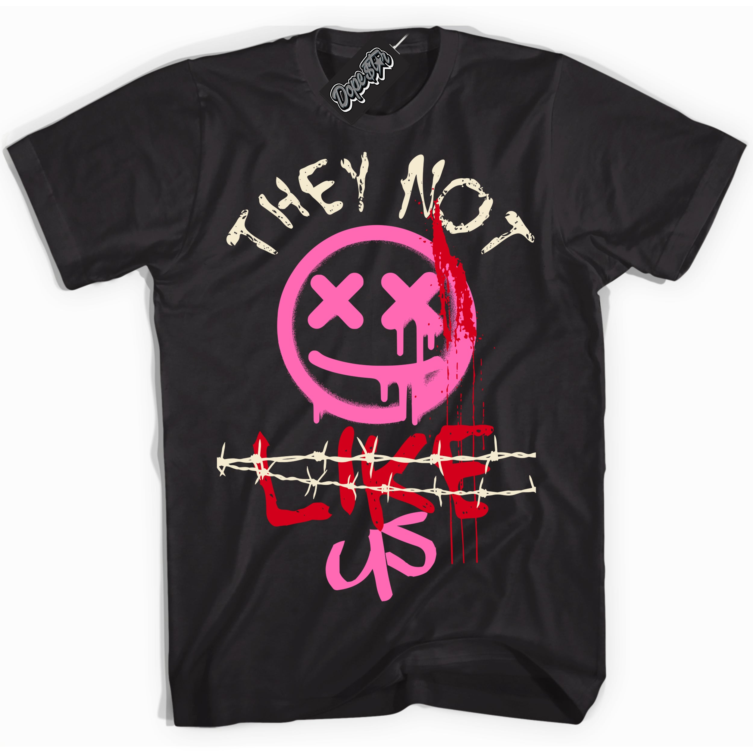 Black “They Not Like Us” T-shirt by Dope Star Brand®, styled to match Pink Satin 1s sneakers
