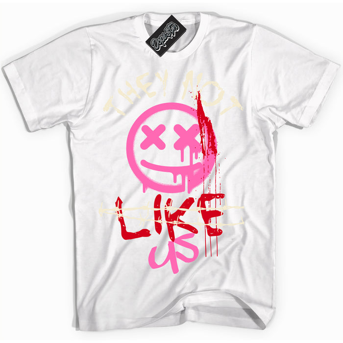 White “They Not Like Us” T-shirt by Dope Star Brand®, styled to match Pink Satin 1s sneakers

