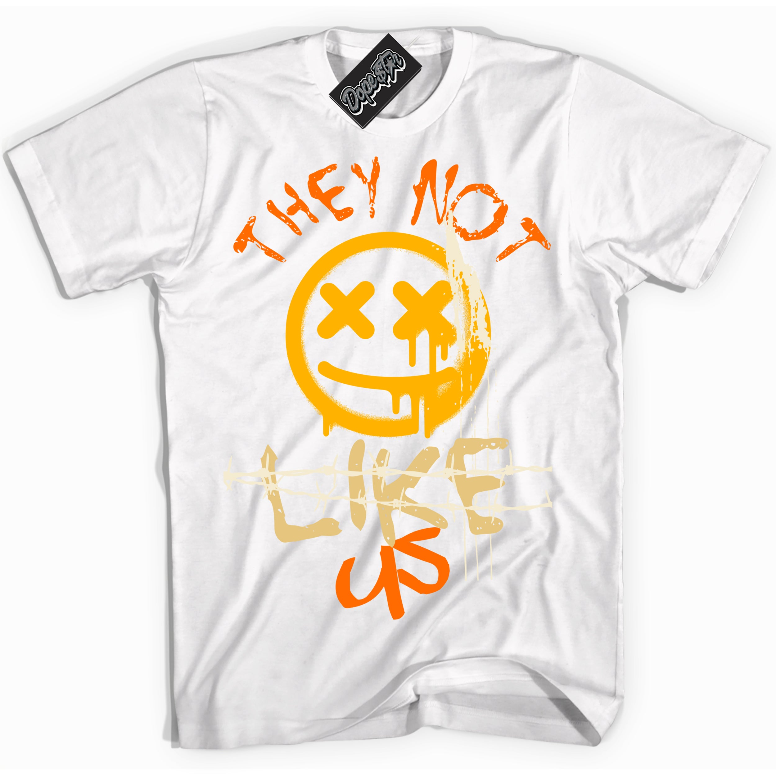 White “They Not Like Us” T-shirt by Dope Star Brand®, styled to match Saturn Gold Dunk sneakers